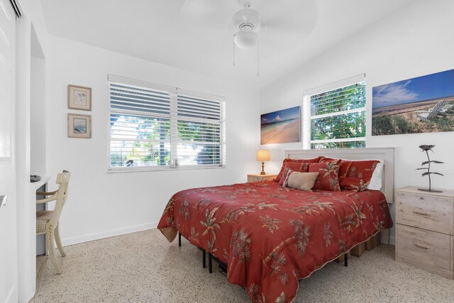 bedroom featuring multiple windows and ceiling fan