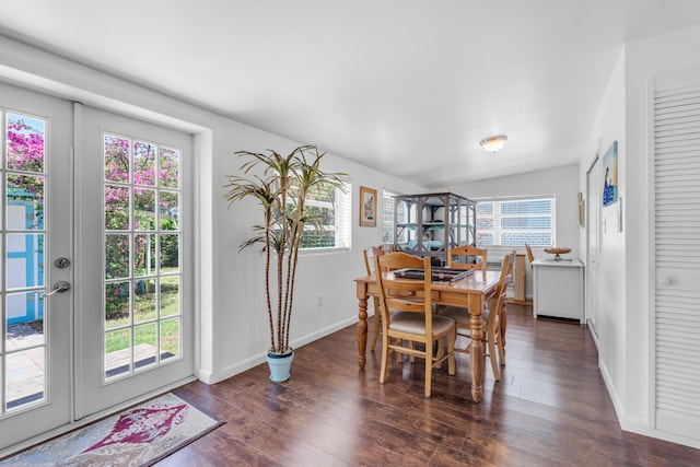 dining area with dark hardwood / wood-style flooring and french doors