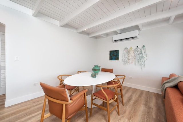 dining room with a wall mounted air conditioner, wood ceiling, light hardwood / wood-style flooring, and beamed ceiling