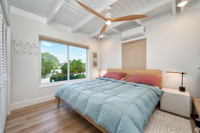 bedroom with a wall mounted air conditioner, beamed ceiling, ceiling fan, wood ceiling, and light hardwood / wood-style floors