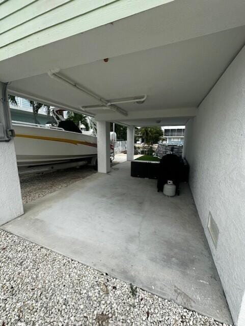 exterior space with a carport