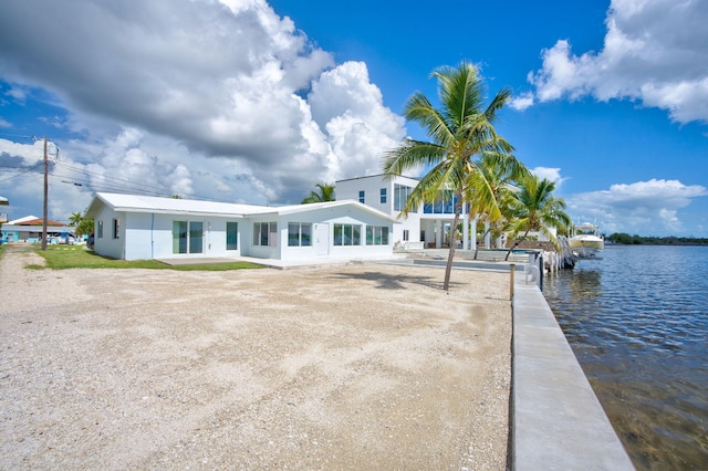 exterior space with a water view