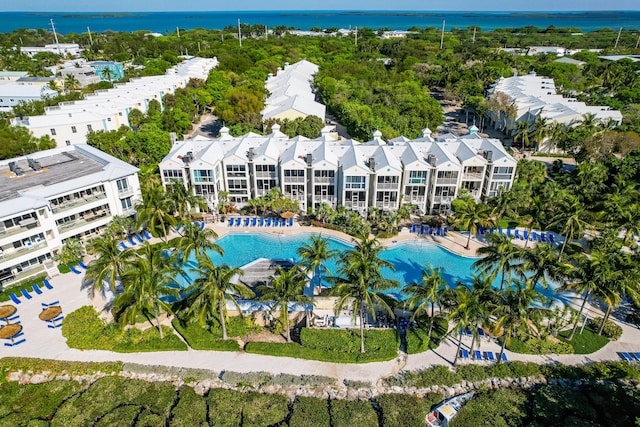 birds eye view of property with a water view