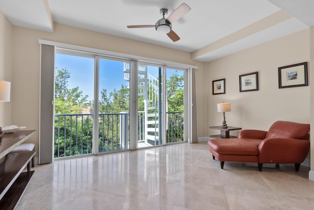 living area with ceiling fan