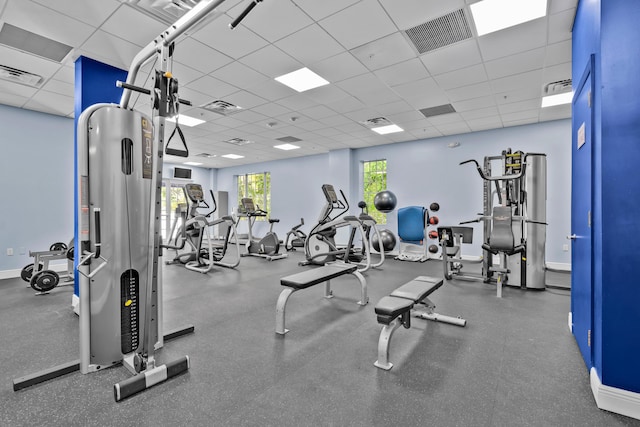 exercise room with a drop ceiling