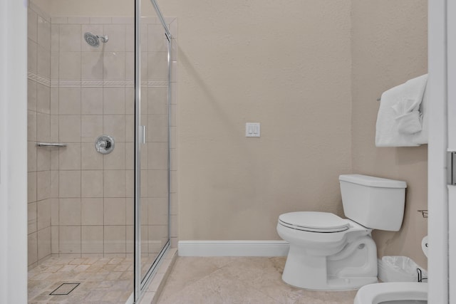 bathroom with tile patterned flooring, toilet, a bidet, and walk in shower