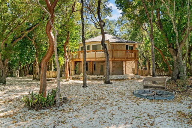 rear view of house featuring a deck