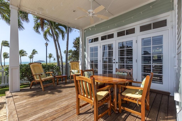 wooden terrace with french doors and ceiling fan