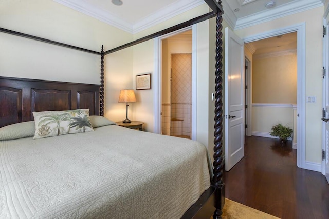 bedroom featuring ornamental molding, baseboards, and wood finished floors