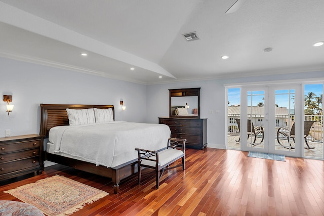 bedroom featuring dark wood-type flooring, access to exterior, and crown molding