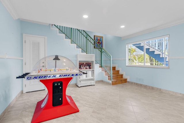 recreation room with crown molding