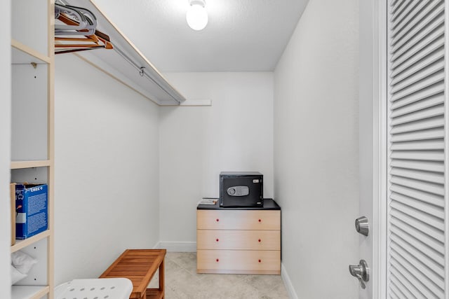 spacious closet featuring light tile patterned flooring