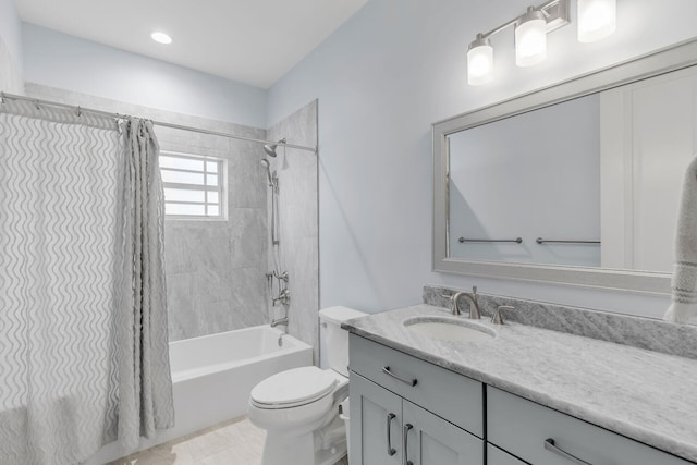 full bathroom featuring shower / tub combo, vanity, and toilet