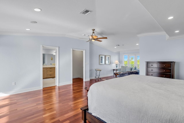 bedroom with connected bathroom, lofted ceiling, dark hardwood / wood-style flooring, ceiling fan, and crown molding