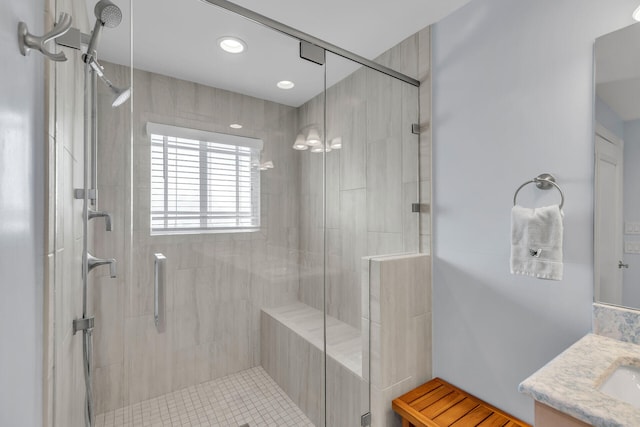 bathroom featuring vanity and an enclosed shower