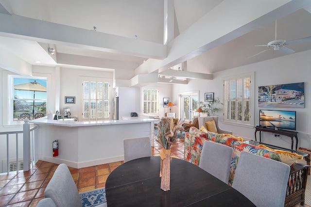 tiled dining space with ceiling fan