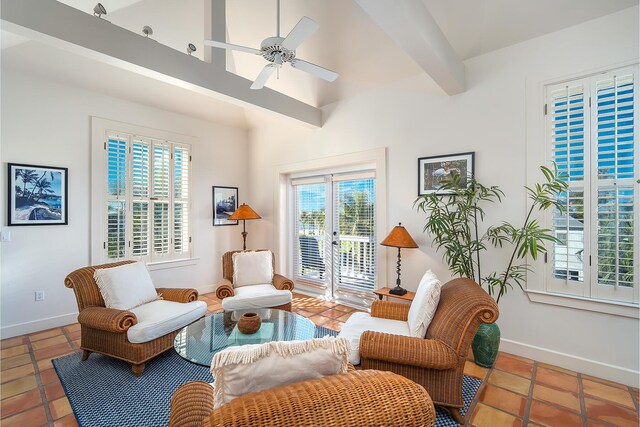 living area featuring tile patterned flooring, ceiling fan, and lofted ceiling with beams