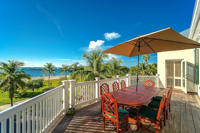 wooden deck featuring a water view