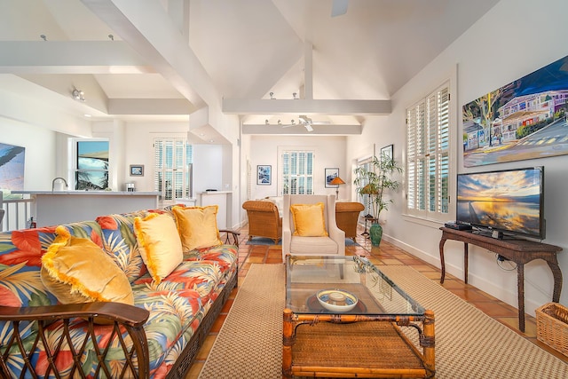 living room with lofted ceiling and light tile patterned floors