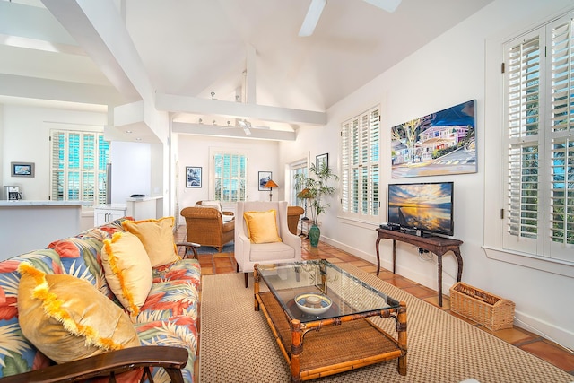 living room featuring vaulted ceiling with beams and ceiling fan