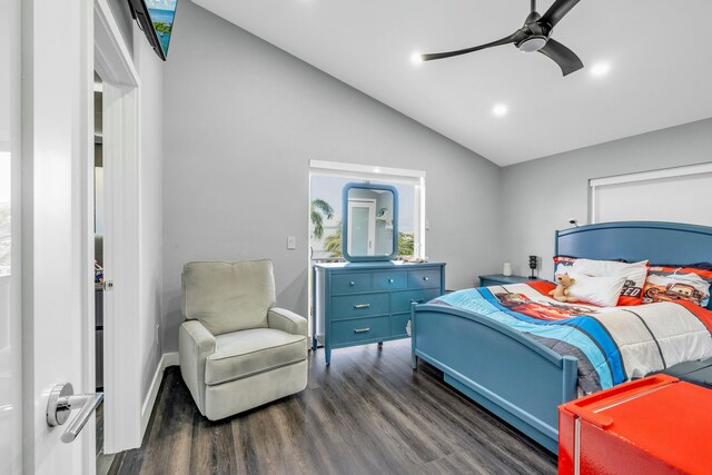 bedroom featuring vaulted ceiling, dark hardwood / wood-style floors, and ceiling fan