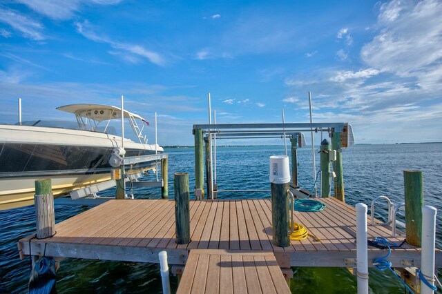 dock area with a water view