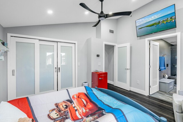 bedroom featuring french doors, dark wood-type flooring, vaulted ceiling, a closet, and ceiling fan