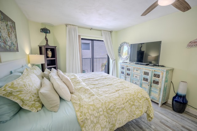 201 E Ocean Dr Unit 3-311, Key Colony, FL 33051 - bedroom with access to exterior, wood finished floors, a ceiling fan, and baseboards