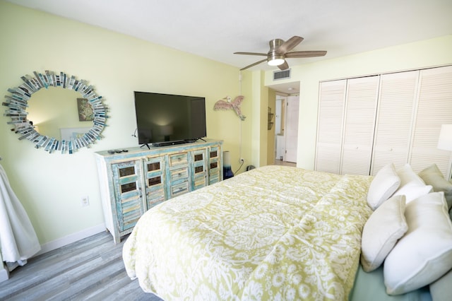 201 E Ocean Dr Unit 3-311, Key Colony, FL 33051 - bedroom with wood finished floors, a closet, baseboards, and a ceiling fan