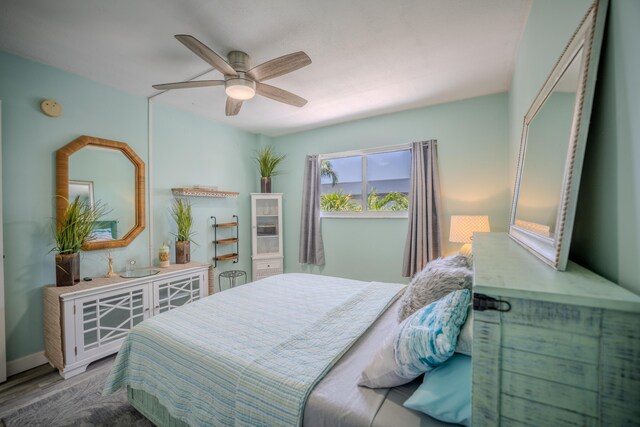 201 E Ocean Dr Unit 3-311, Key Colony, FL 33051 - bedroom with wood finished floors and ceiling fan