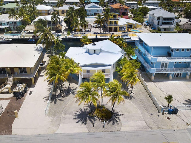 birds eye view of property with a residential view