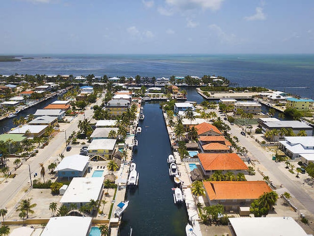 aerial view featuring a water view and a residential view