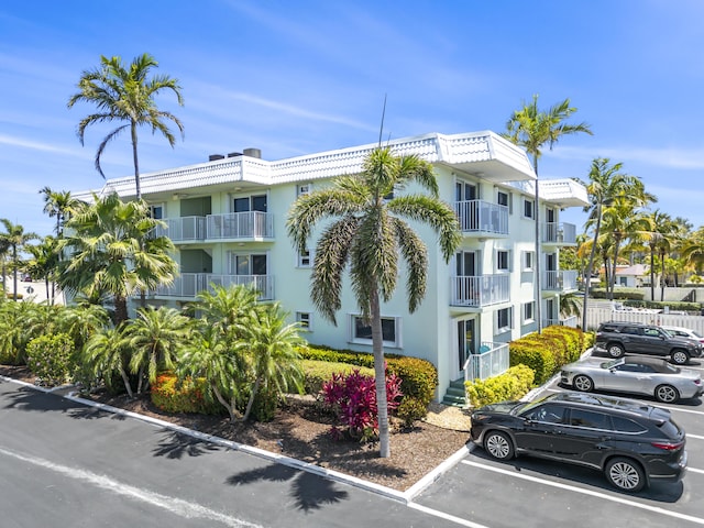 1101 W Ocean Dr Unit 29, Key Colony, FL 33051 - view of building exterior with uncovered parking