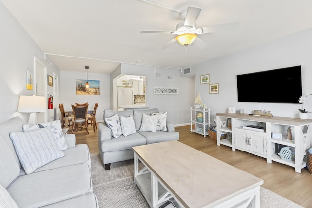 1101 W Ocean Dr Unit 29, Key Colony, FL 33051 - living room with light wood-style floors and a ceiling fan