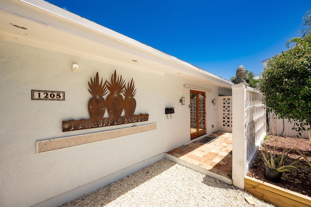 1205 11th St, Key West, FL 33040 - property entrance featuring french doors and stucco siding
