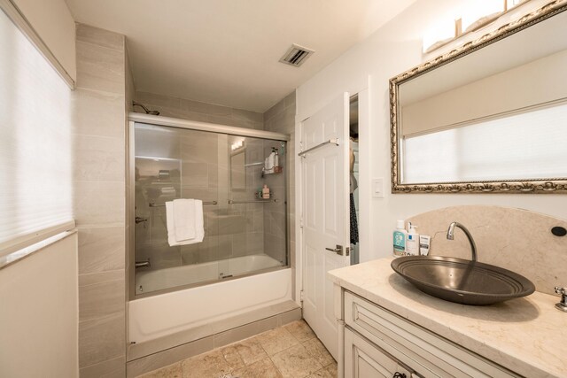 1205 11th St, Key West, FL 33040 - bathroom with enclosed tub / shower combo, vanity, and visible vents