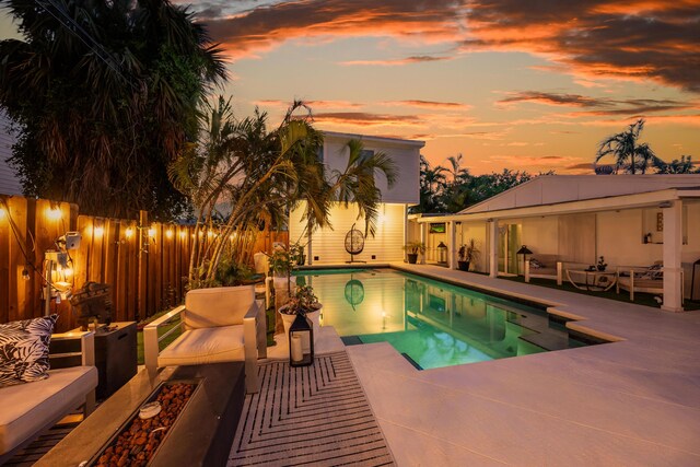 1205 11th St, Key West, FL 33040 - view of swimming pool featuring a fenced in pool, an outdoor living space, a patio area, and a fenced backyard