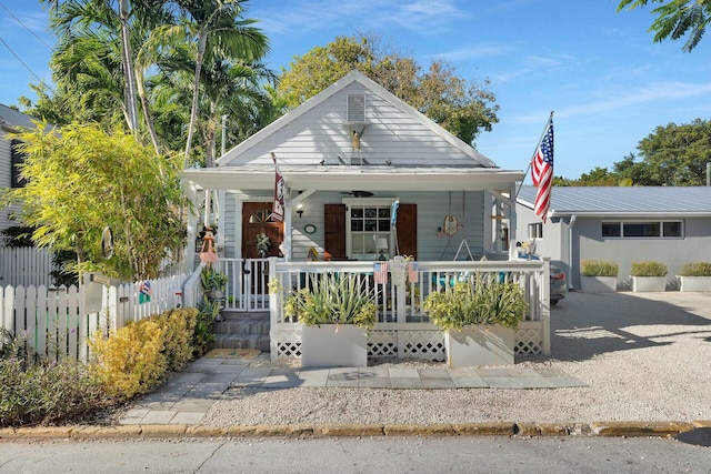 bungalow with covered porch and fence