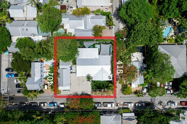 birds eye view of property with a residential view