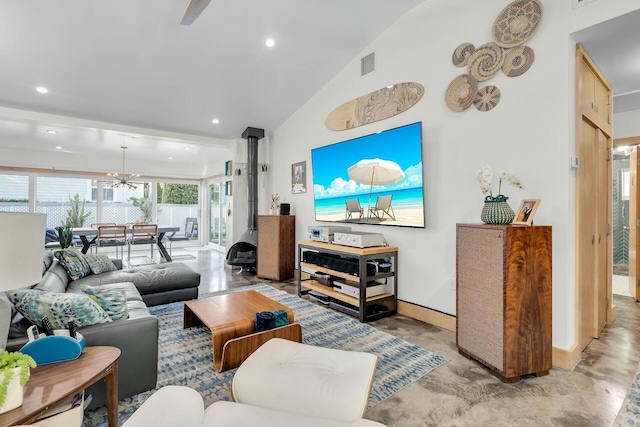 living area featuring a wood stove, high vaulted ceiling, visible vents, and recessed lighting