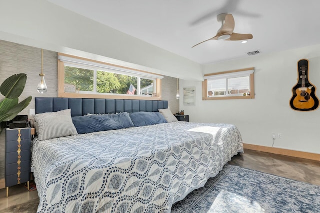 bedroom featuring ceiling fan, visible vents, and baseboards