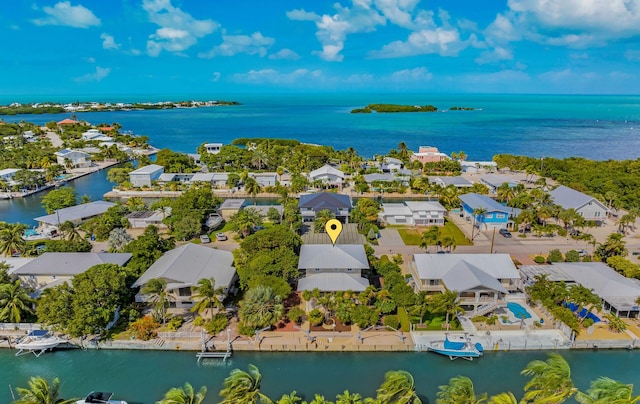 drone / aerial view with a residential view and a water view