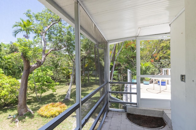 unfurnished sunroom featuring a healthy amount of sunlight