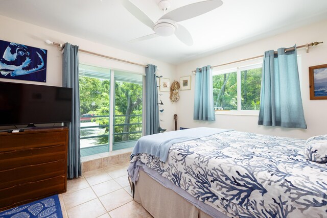 bedroom featuring light tile patterned floors, access to outside, and ceiling fan