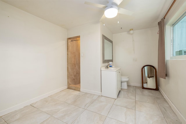 bathroom featuring vanity, tile patterned floors, a shower, and toilet