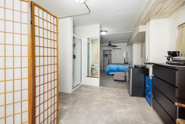 bathroom with tile patterned flooring, a bidet, ceiling fan, and a shower with shower door