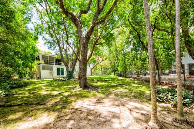 view of yard featuring a sunroom