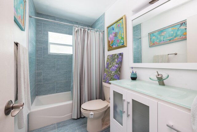 full bathroom featuring vanity, shower / bathtub combination with curtain, and toilet