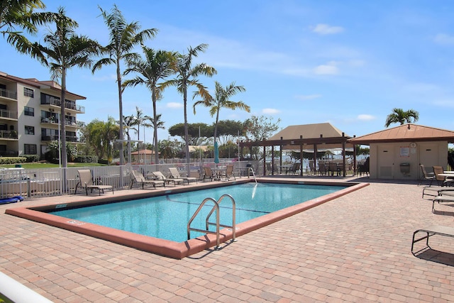 view of swimming pool featuring a gazebo and a patio area