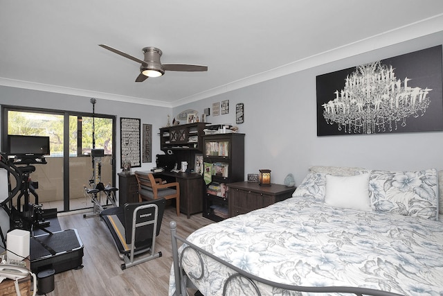 bedroom featuring hardwood / wood-style flooring, ceiling fan, and ornamental molding